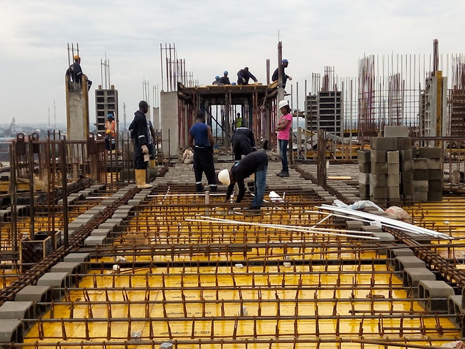 Engineers reviewing construction drawings and planning project execution
